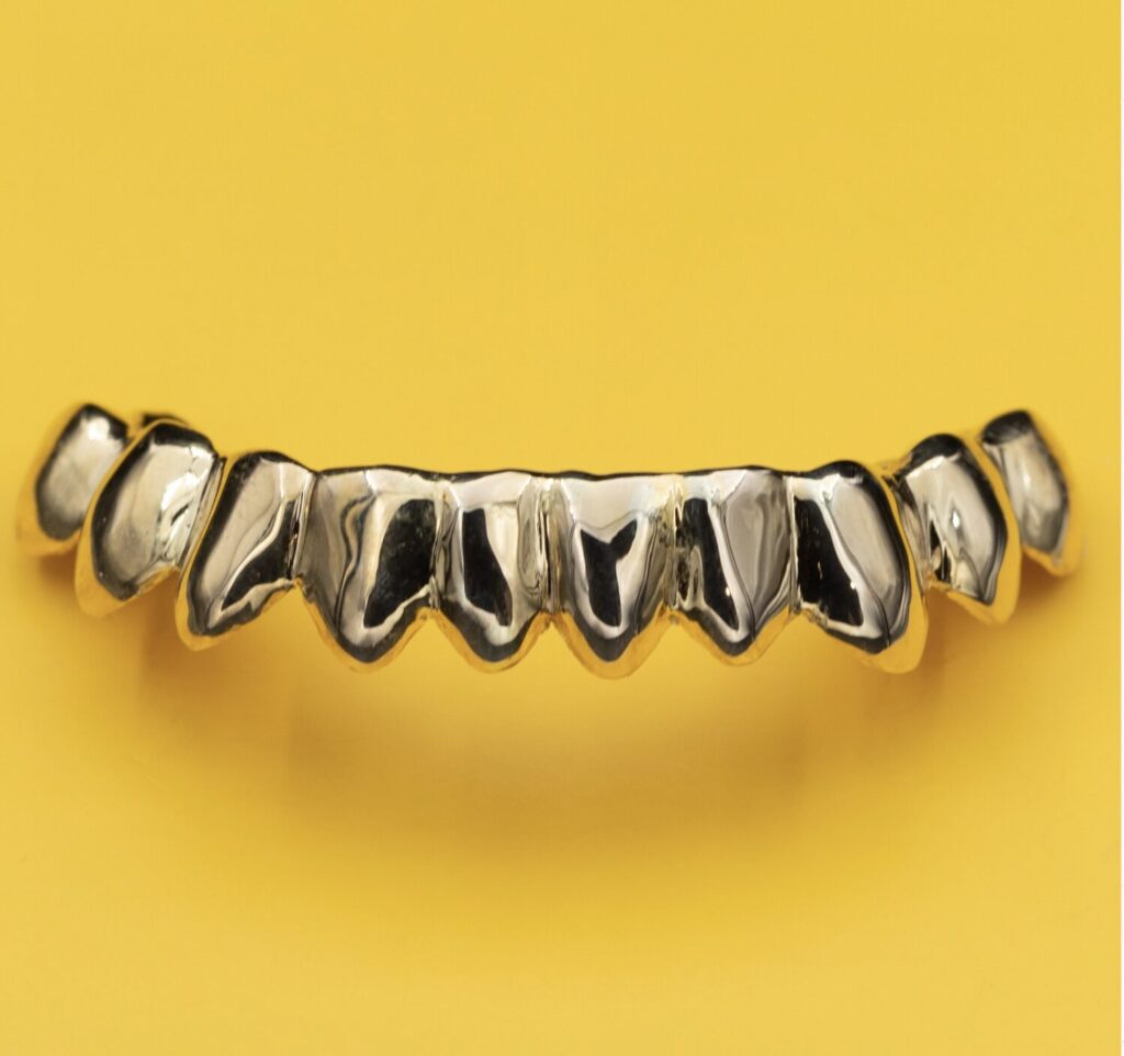 Custom silver grillz by Dr. Grillz, handcrafted using dental-grade materials and designed for a precise, removable fit.