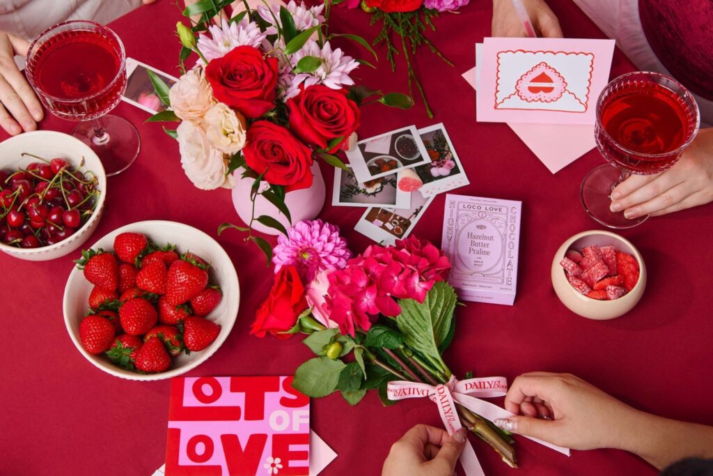Friends sharing Daily Blooms flowers and gifts around a table